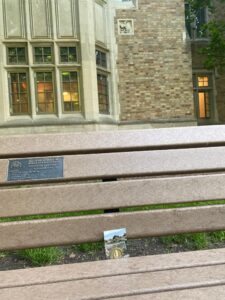 # 1359 on a bench in front of Alumni Hall